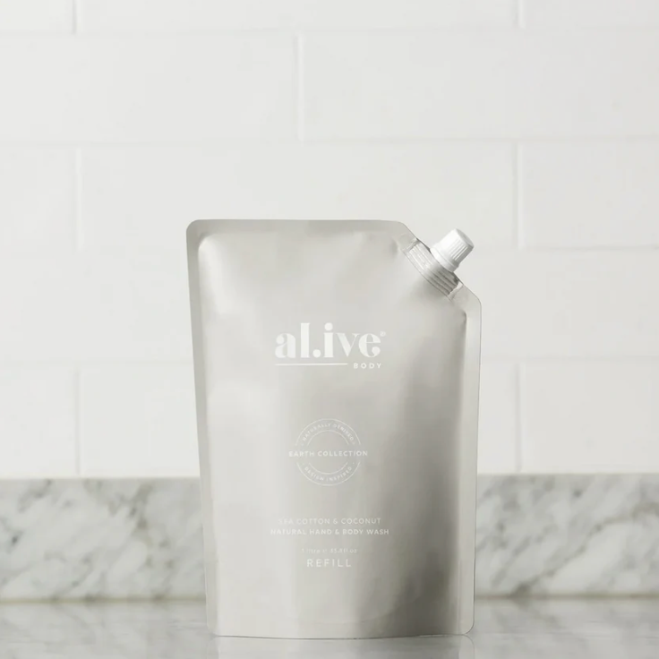 White refill pouch with 'alive' branding on a marble surface