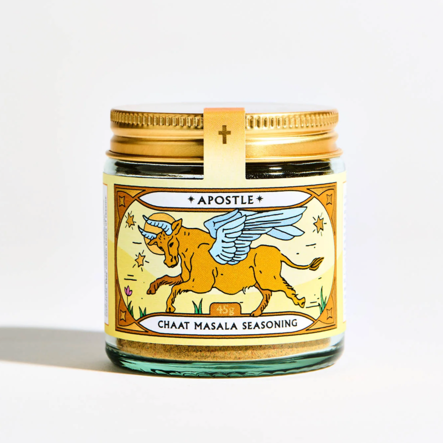 Jar of 'Apostle' Chaat Masala seasoning with a gold lid on a white background