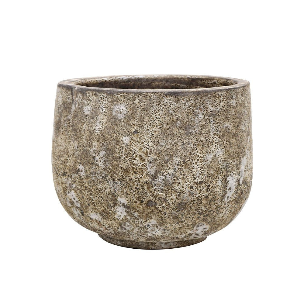 Textured ceramic pot on a white background