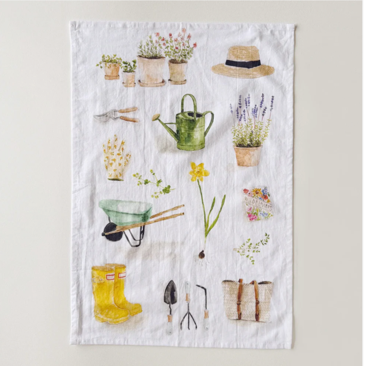 Decorative towel with gardening-themed design on a white background, featuring the brand 'Emily Lex Studio'.