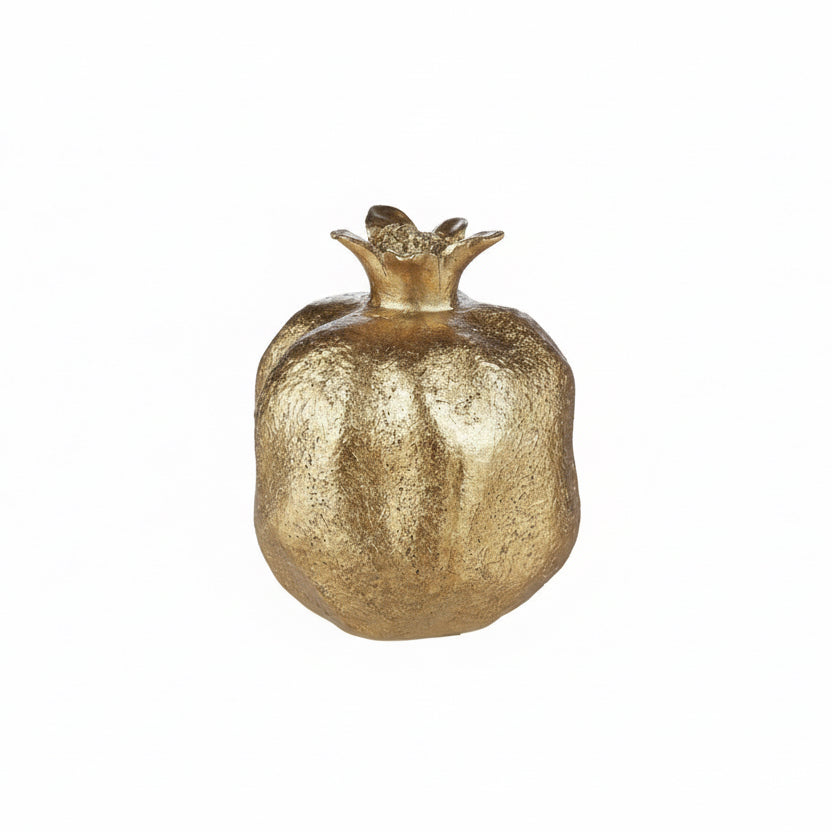 Decorative gold pomegranate on a white background