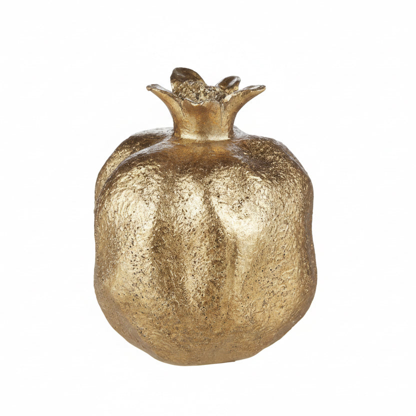 Decorative gold pomegranate on a white background