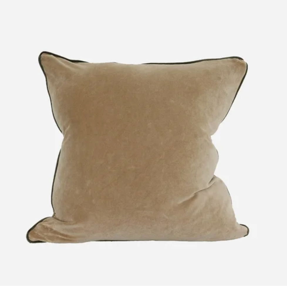 Beige pillow with a black border on a white background