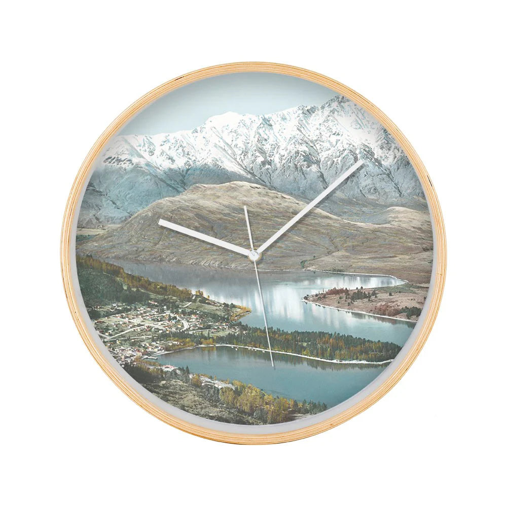Round wall clock with a scenic design of Queentown mountains and lake on a white back ground