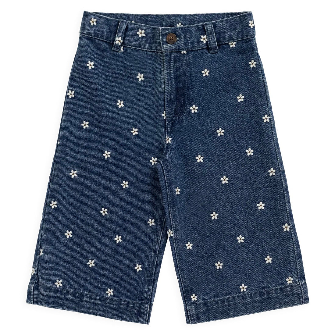 Blue denim shorts with white floral patterns on a white background