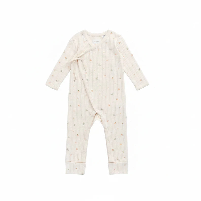 Baby onesie with long sleeves and legs on a white background