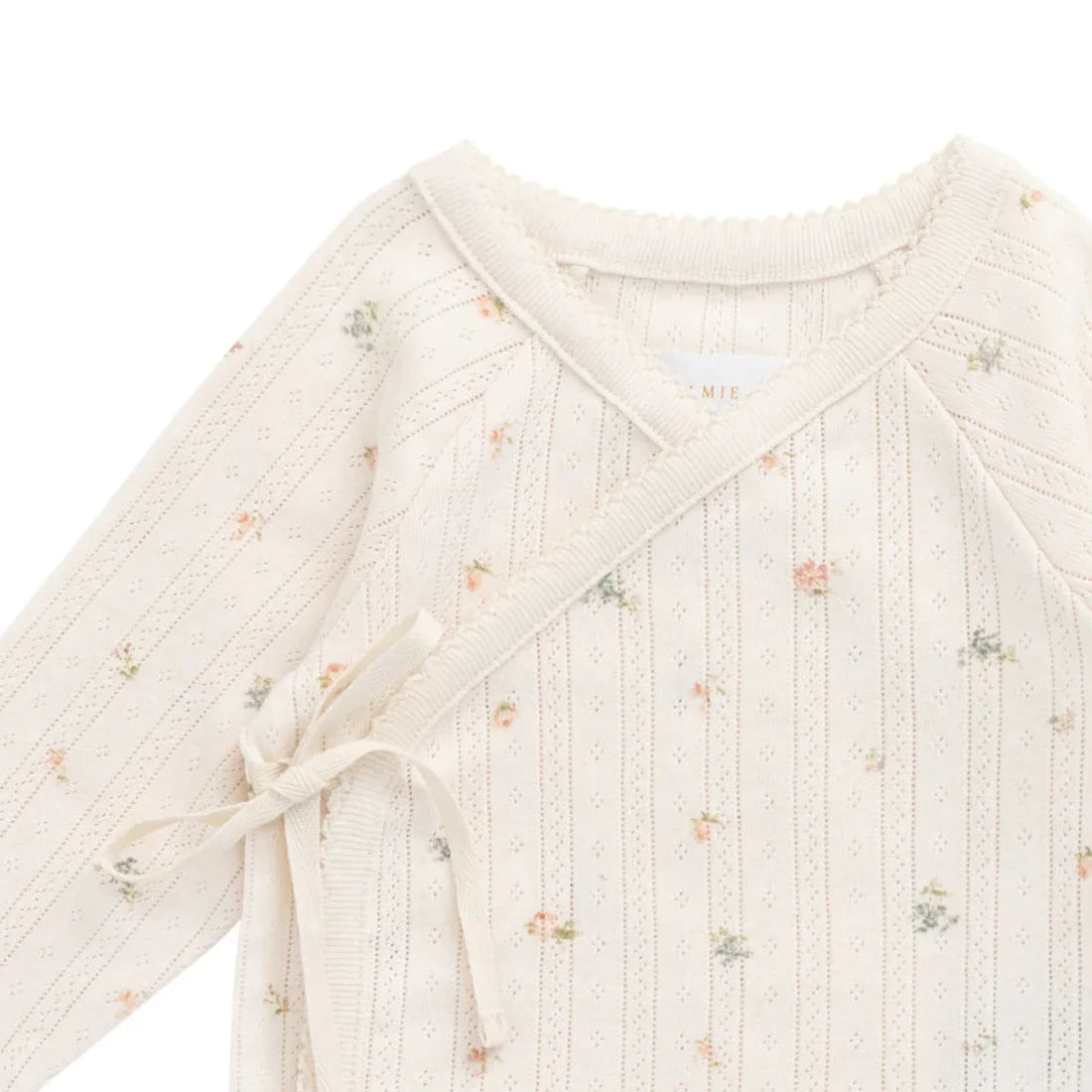 Baby romper with floral pattern on a white background