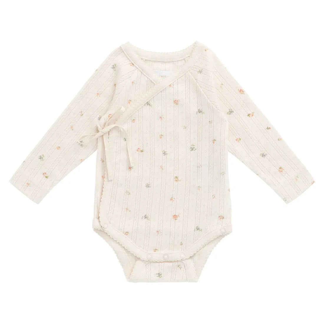 White baby onesie with subtle pattern on a white background