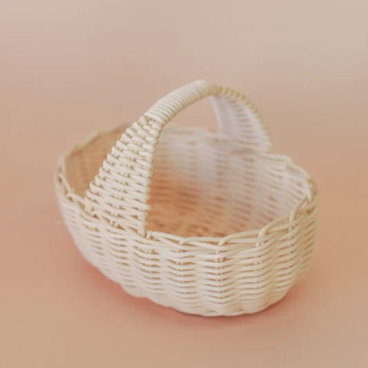 Wicker basket on a peach background