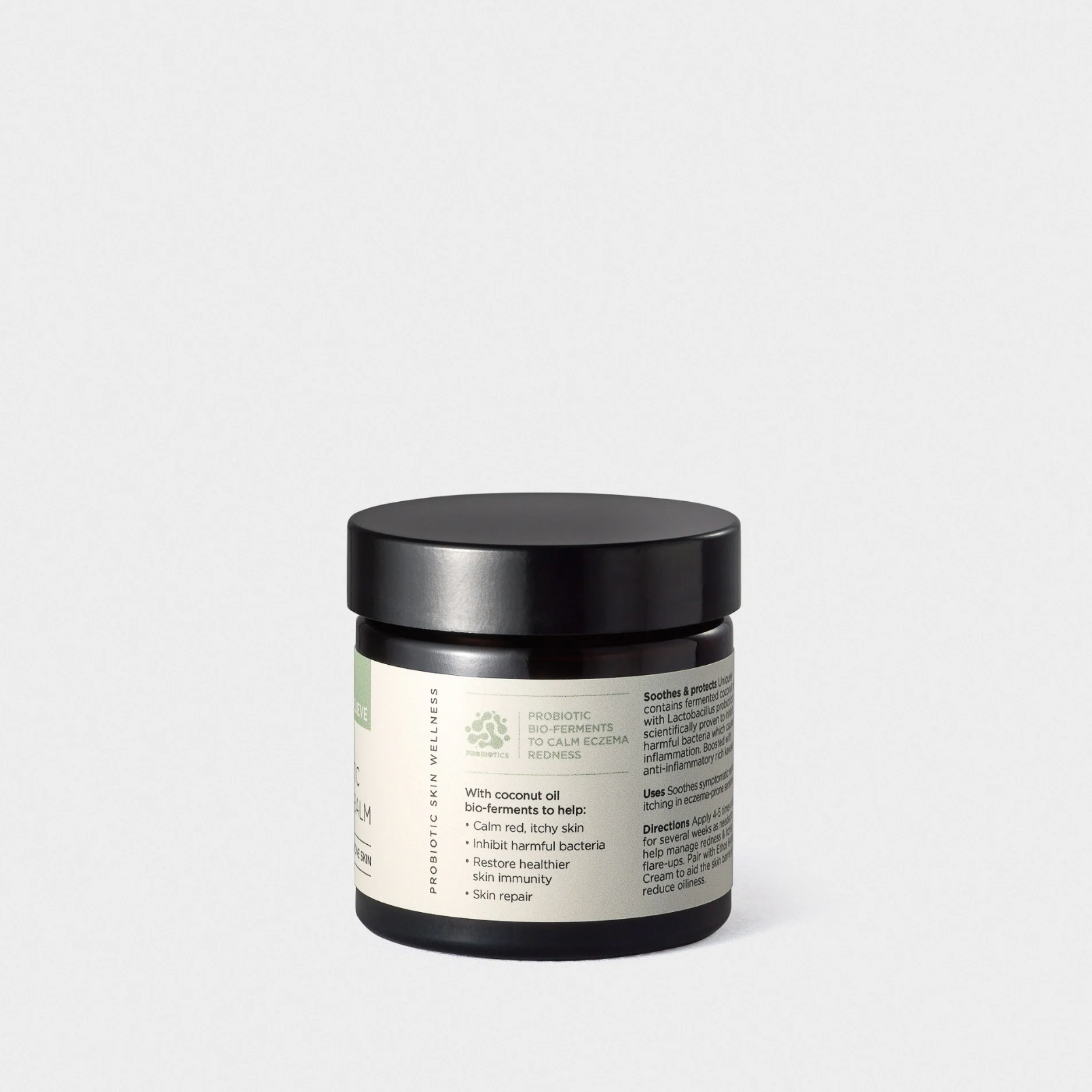 Jar of cream with a black lid on a white background