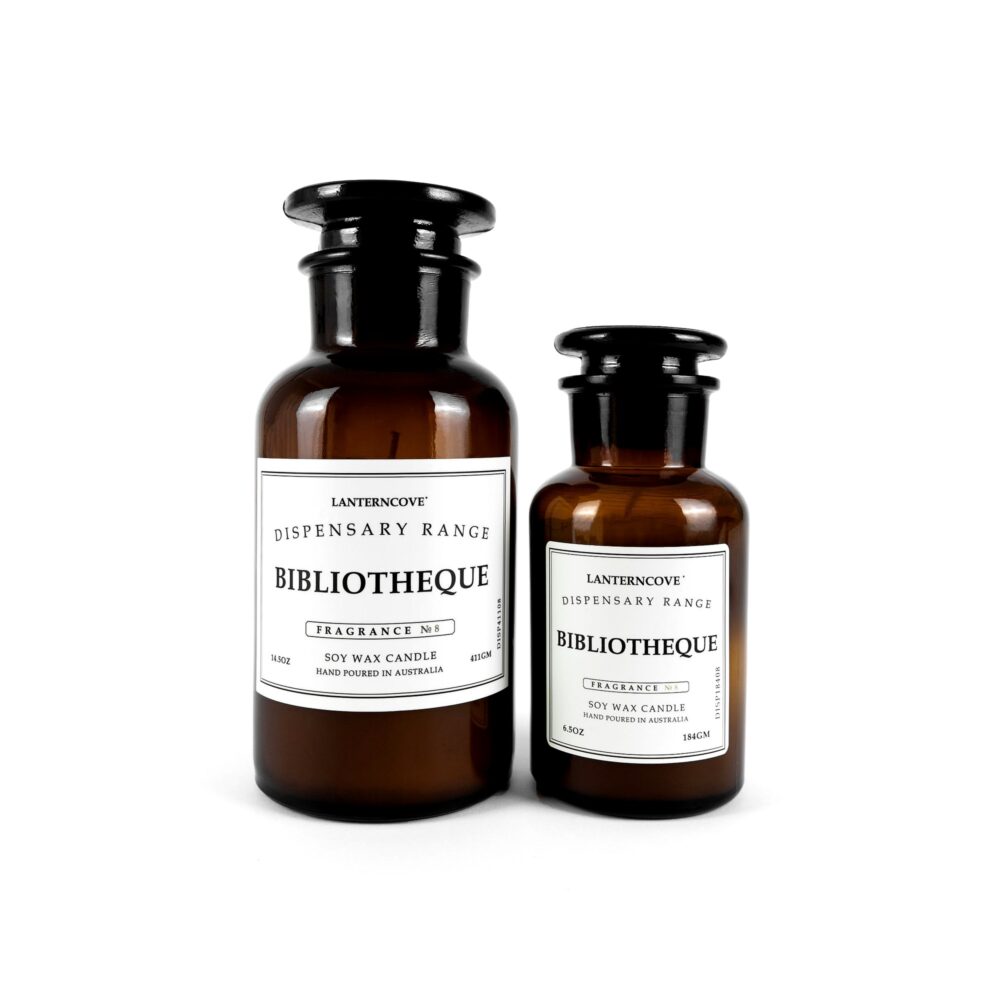 Two Lanterncove Dispensary brown bottle candles with white labels on a white background