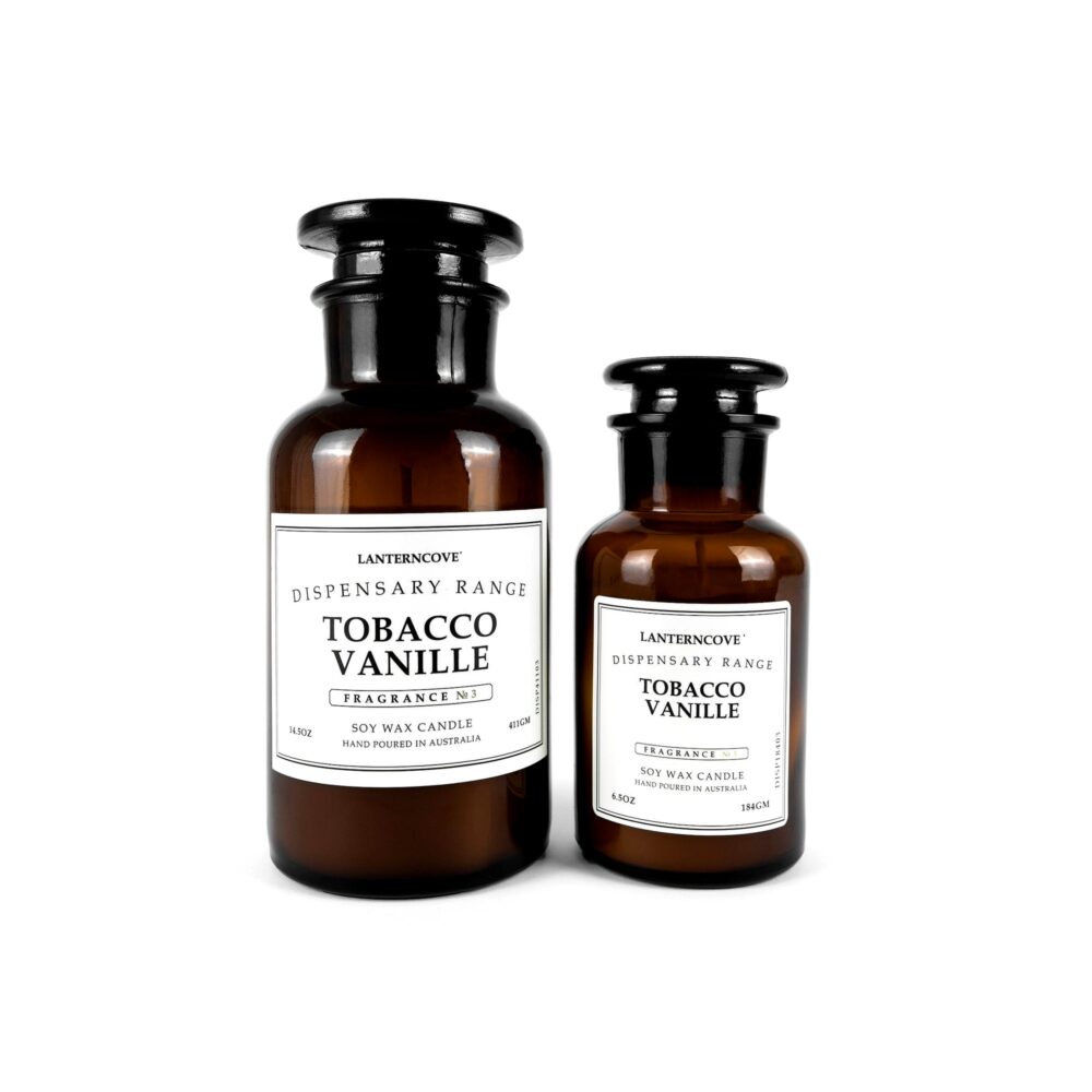 Two brown bottles candles labeled 'Tobacco Vanille' on a white background