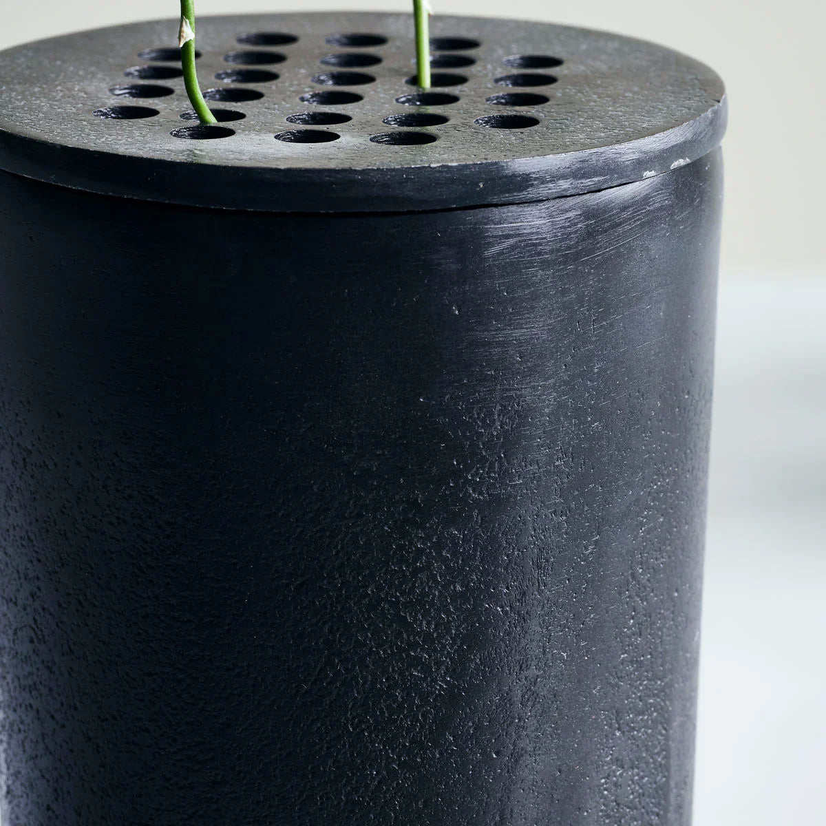 close up of black metal vase Wabi Sabi style