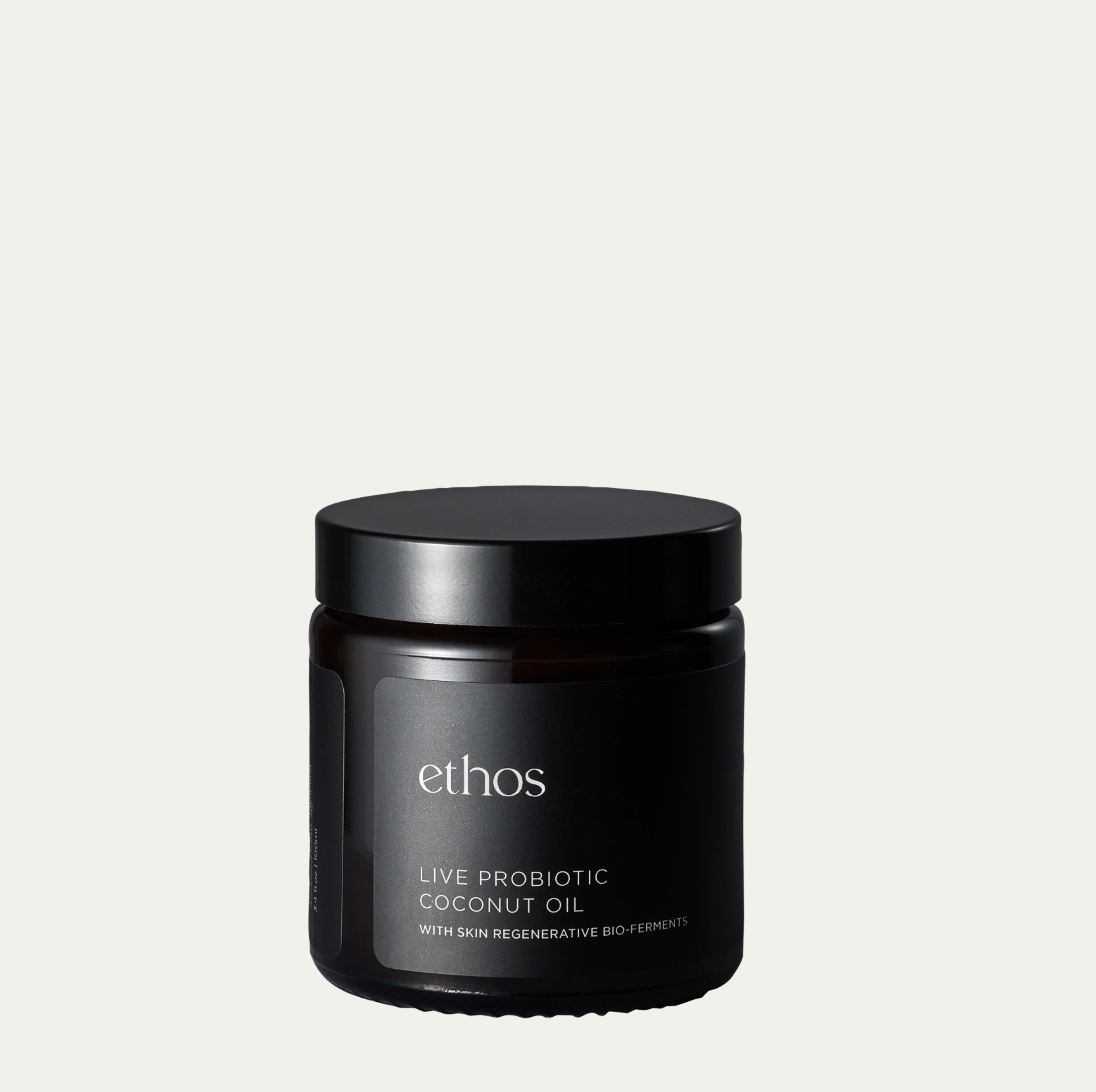 Black jar with 'ethos' branding on a light gray background