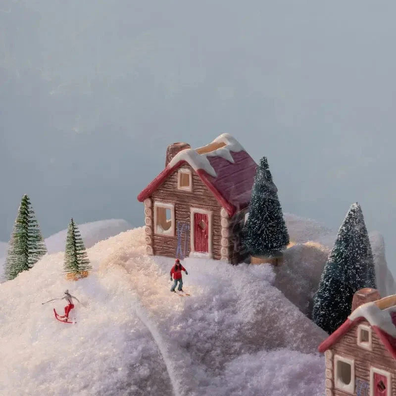 Miniature model of a snowy landscape with houses and trees