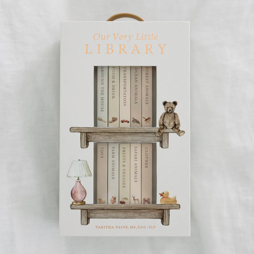 Product packaging for 'Our Very Little Library' with books and a teddy bear on a shelf.