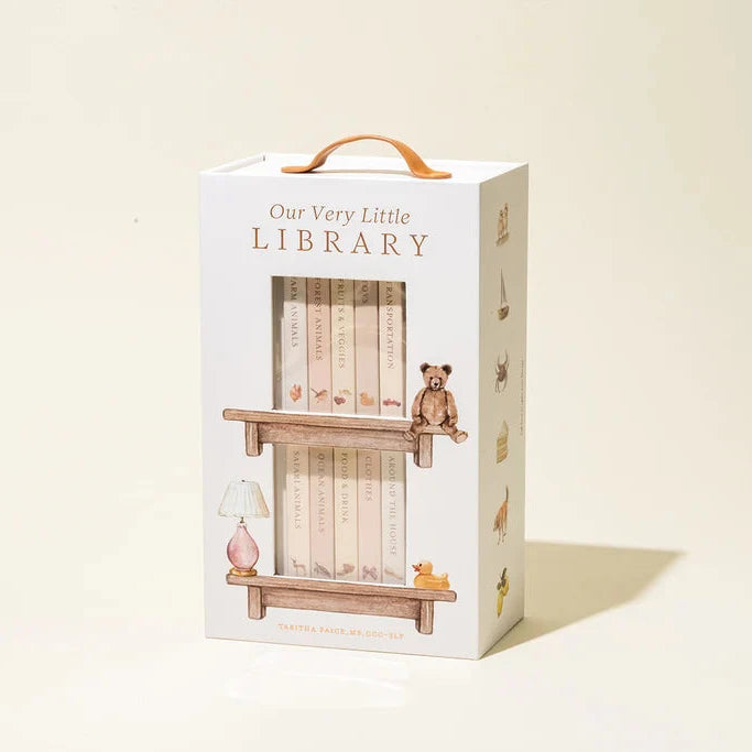 Box packaging for 'Our Very Little Library' with illustrations of a shelf and teddy bear on a beige background.