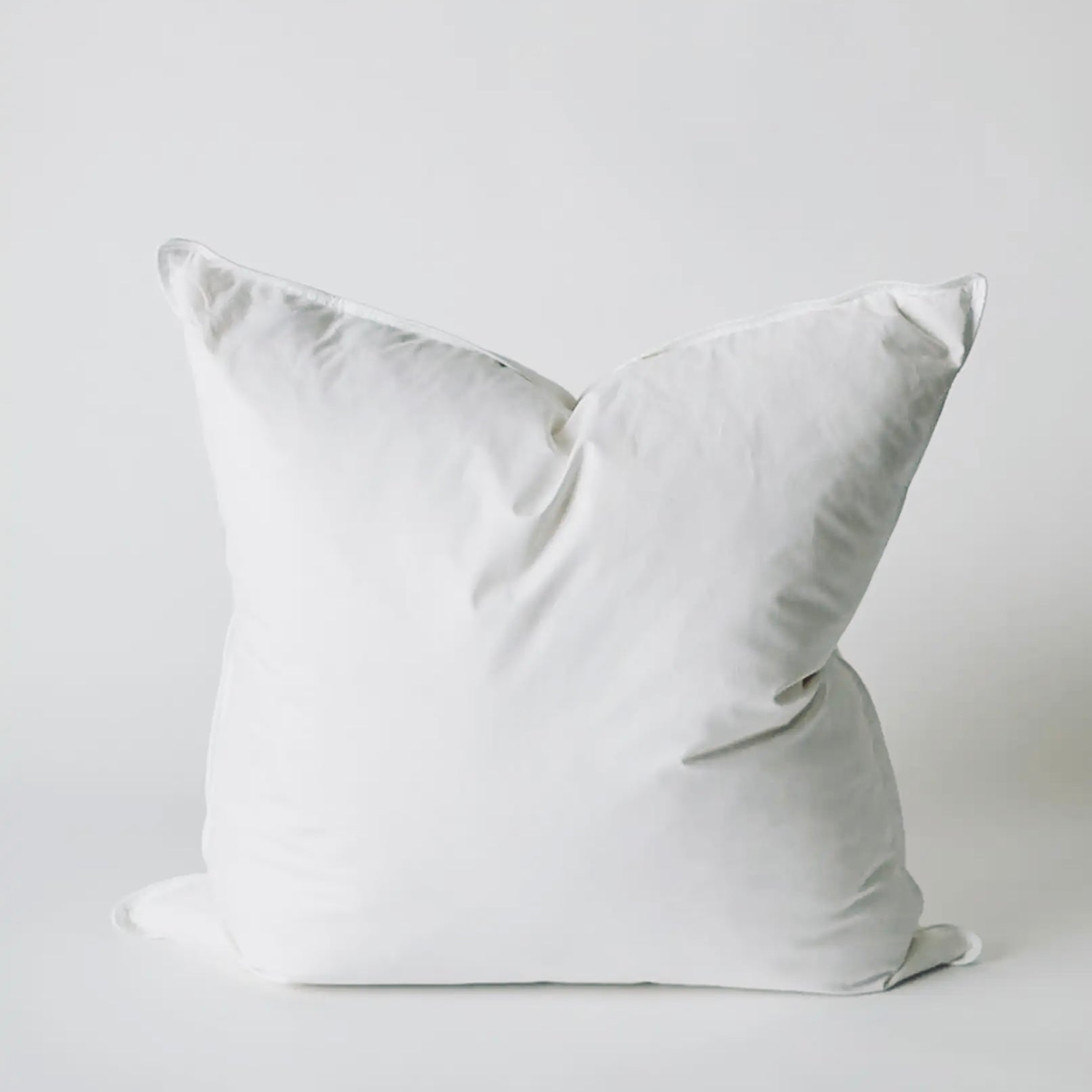 White pillow on a light gray background
