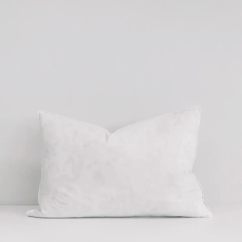White pillow on a light gray background