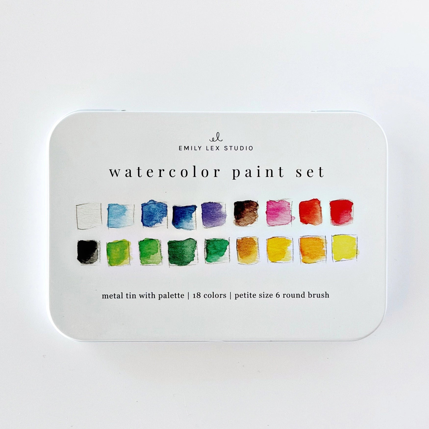 Watercolor paint set with color swatches on a white background