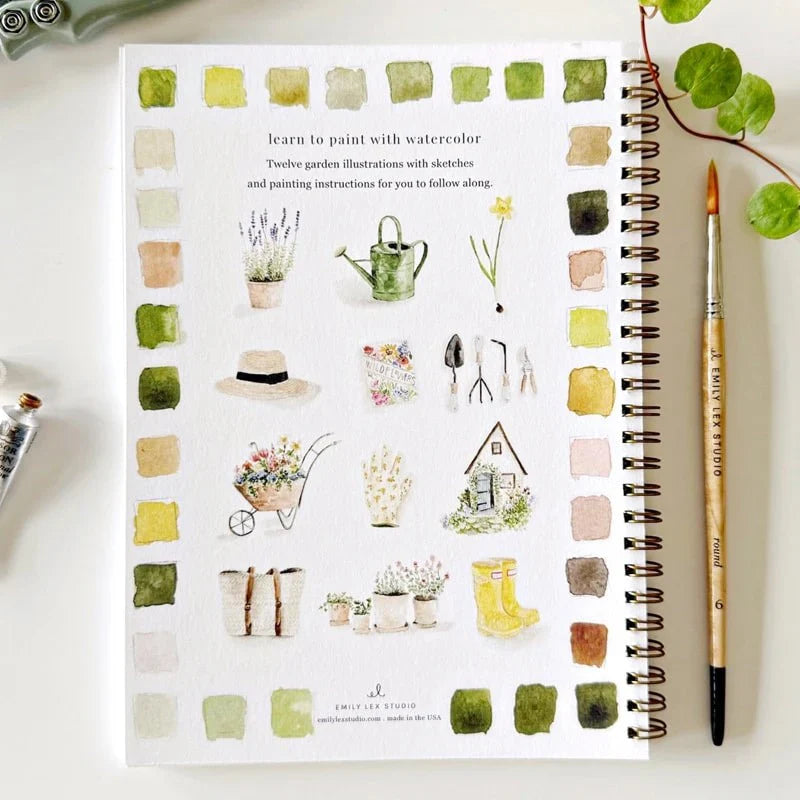 watercolour workbook of plants and gardening tools, accompanied by a brush