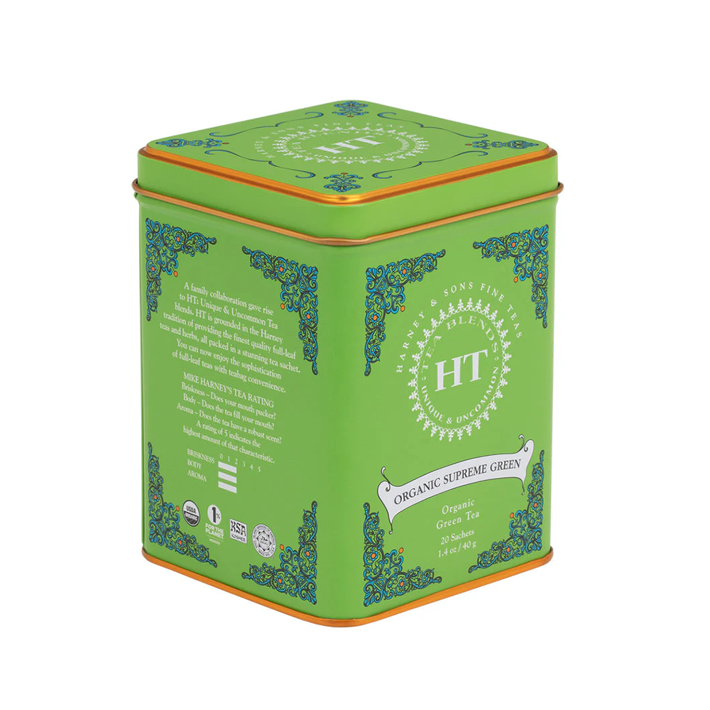 Green tea tin with decorative elements and branding on a white background