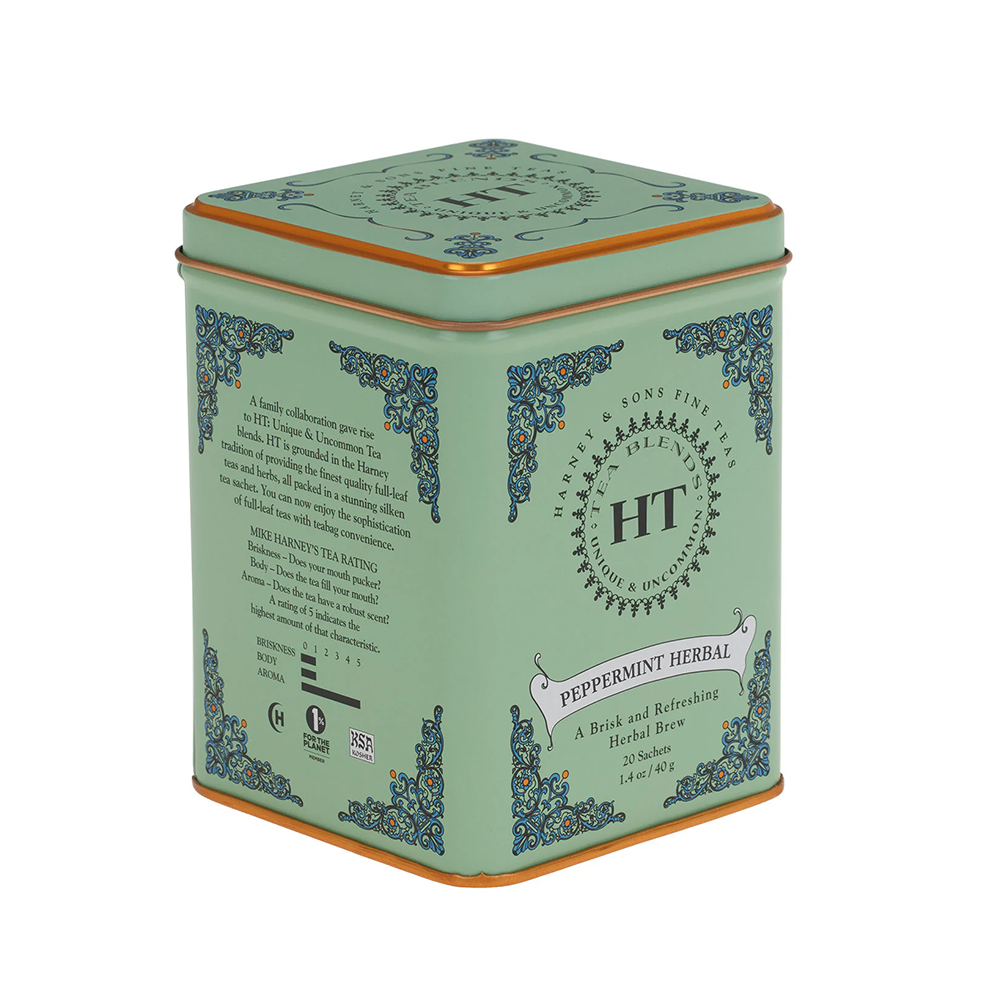 Tea tin with decorative elements and branding on a white background