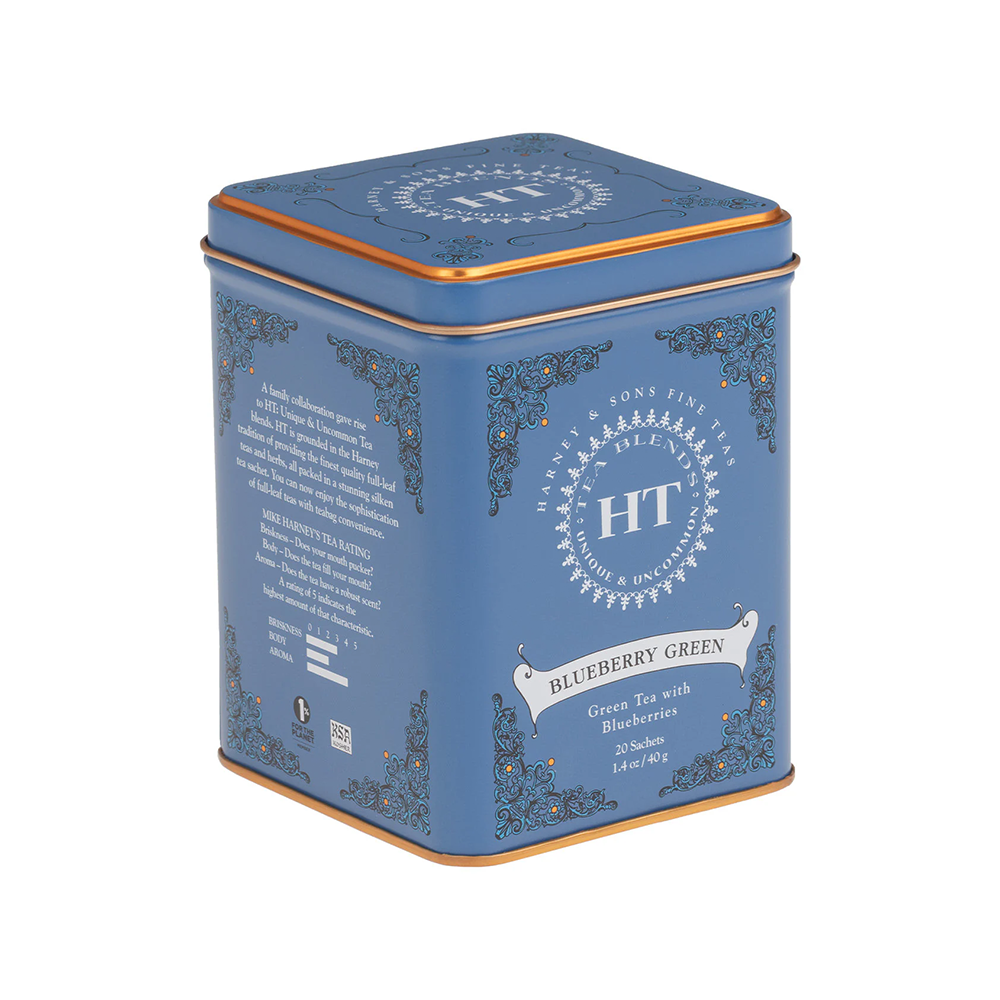 Blueberry Green tea tin with gold accents on a white background