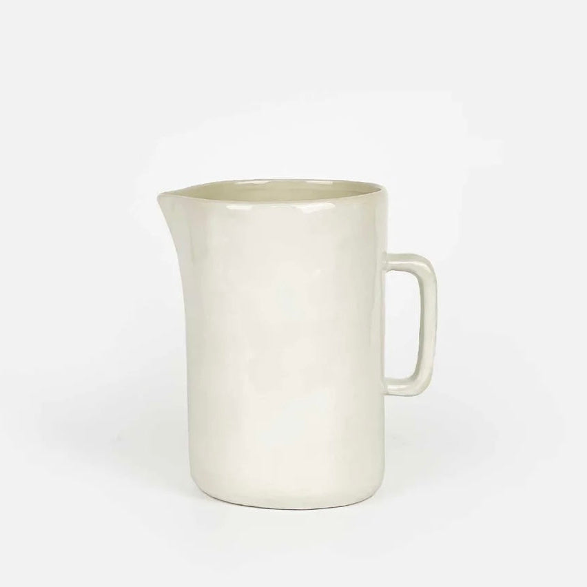White ceramic pitcher on a white background