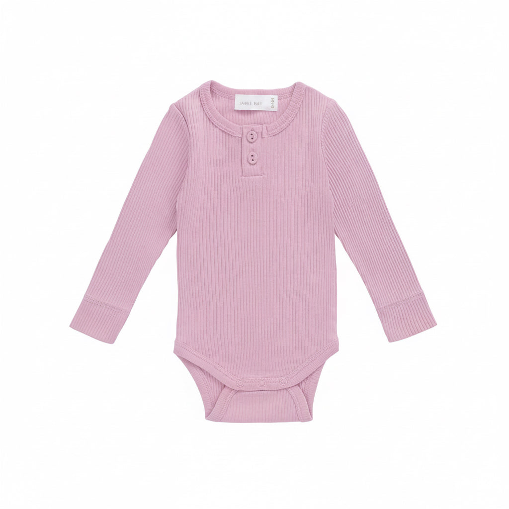 Pink ribbed baby bodysuit with buttons on a white background