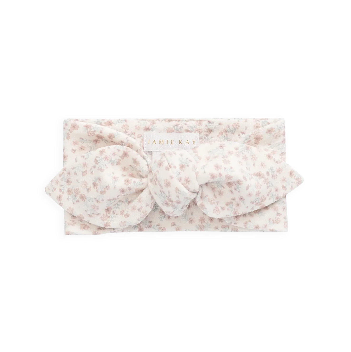 A light pink and white floral headband with a large bow, shown flat against a solid white background.