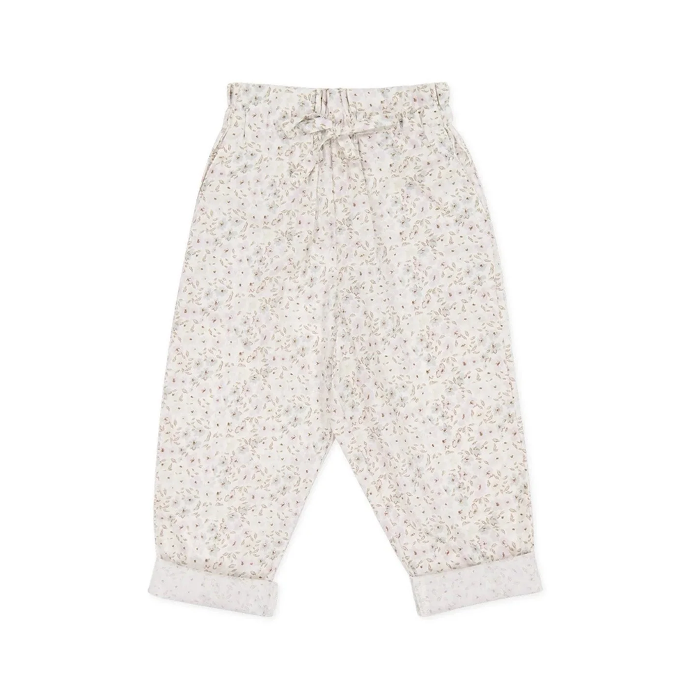 A pair of toddler's loose-fit pants in a delicate cream and beige floral print, featuring an elastic waistband with a drawstring and cuffed ankles, laid flat on a white background.