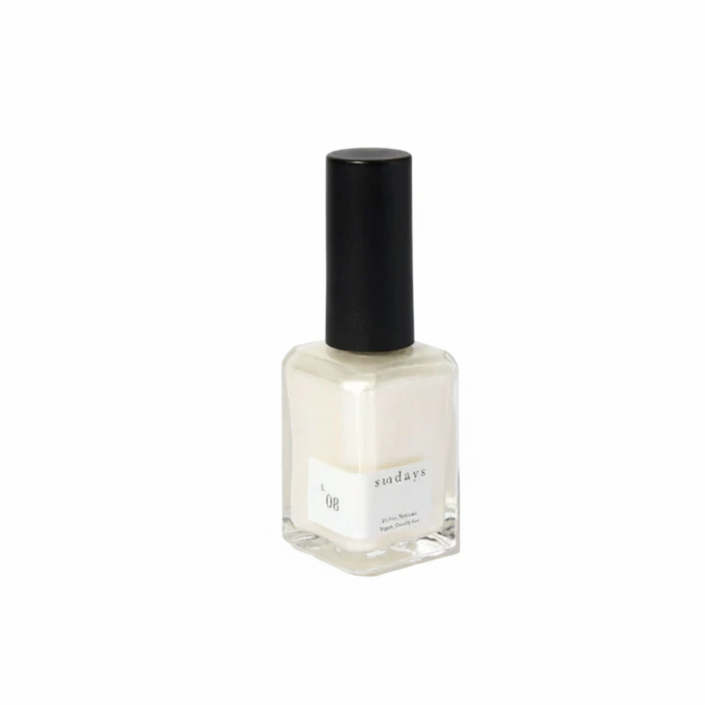 Nail polish bottle with black cap on a white background
