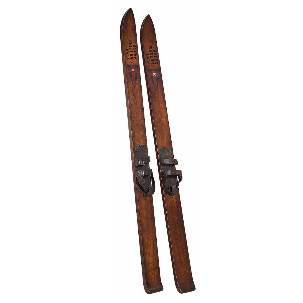 Pair of wooden skis with metal bindings on a white background