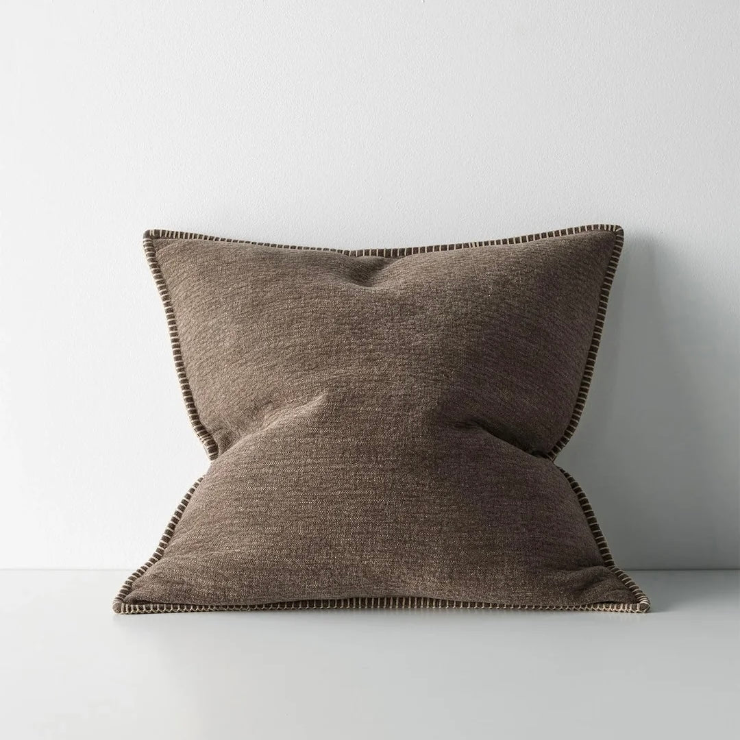Brown pillow on a light gray background