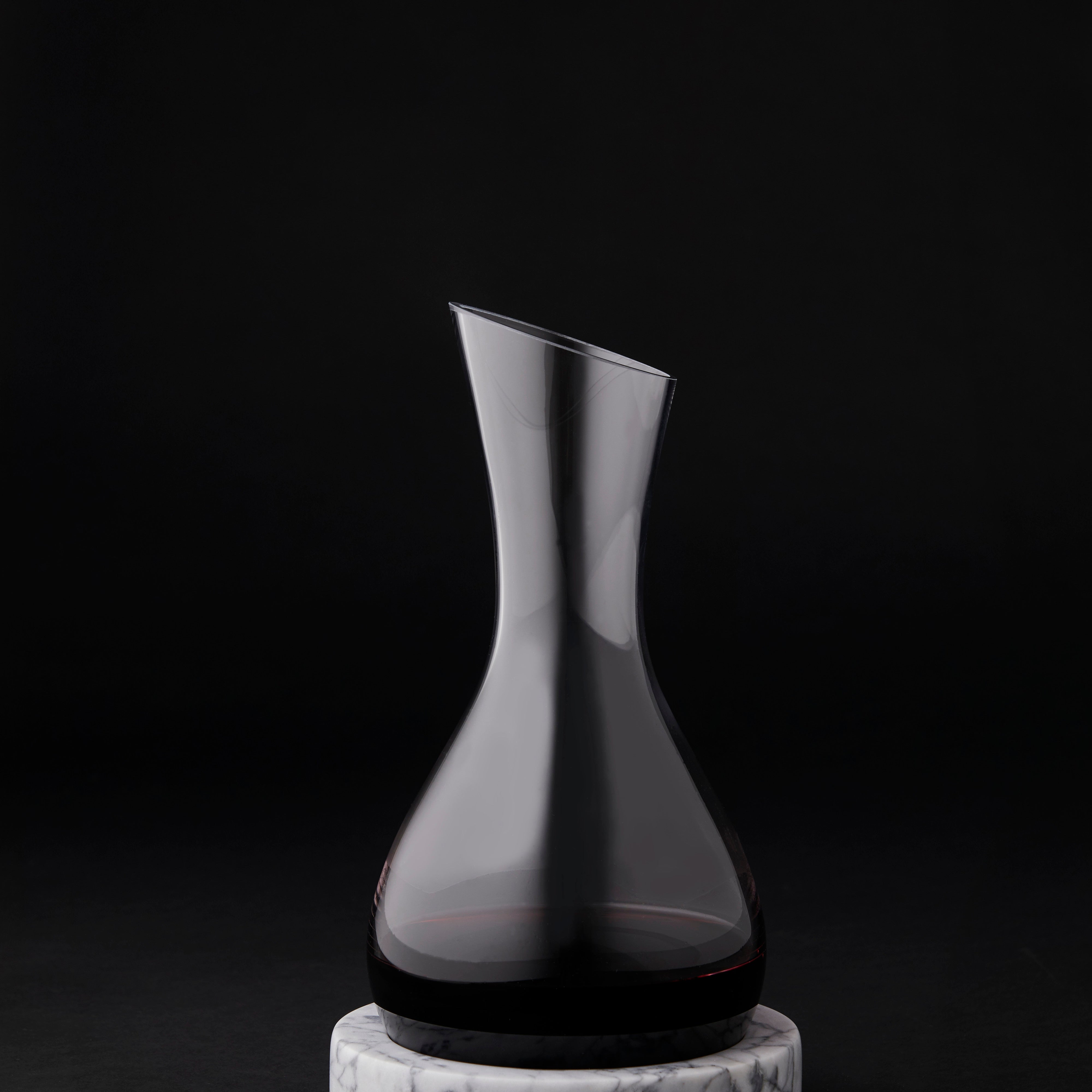Black glass carafe on a black background