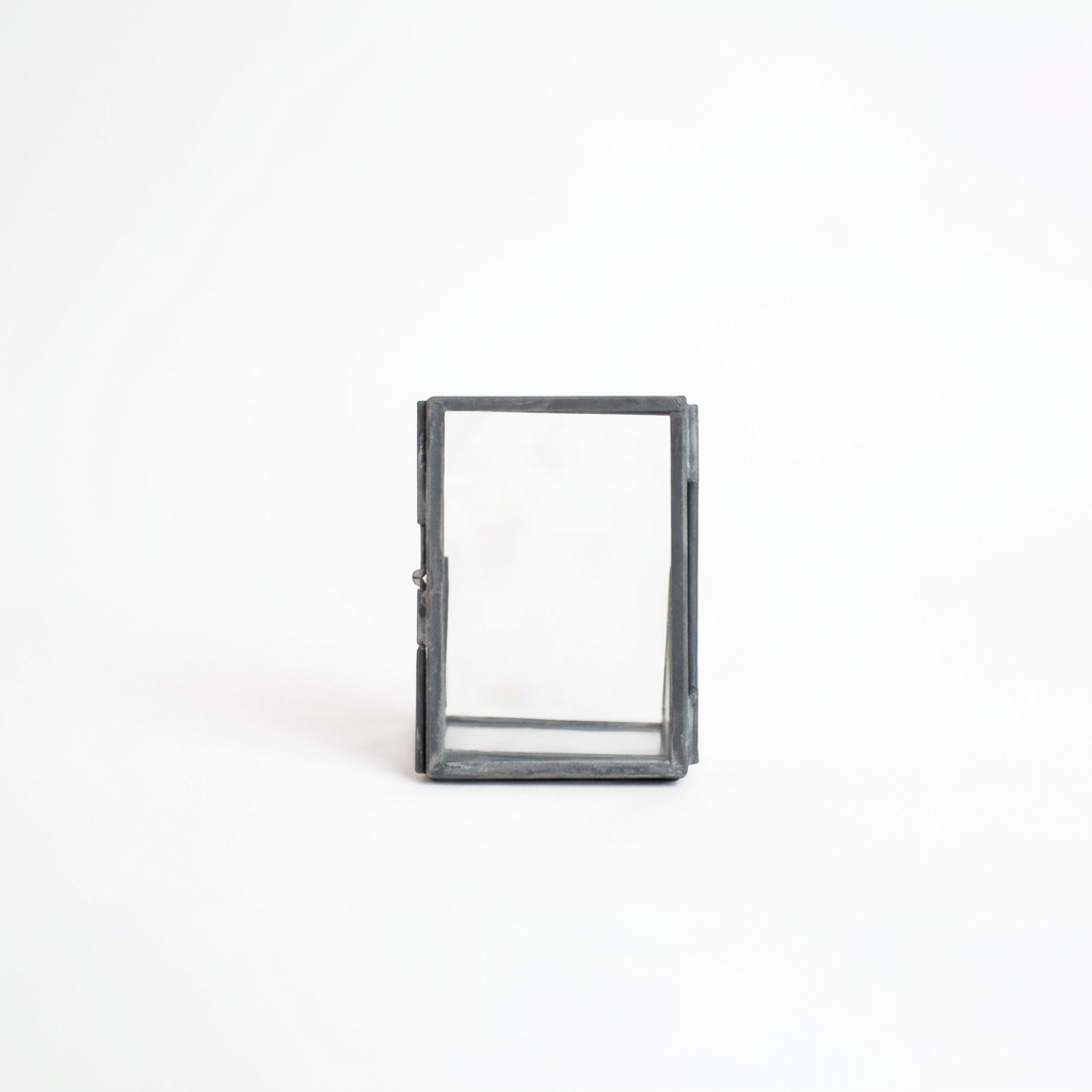 Rectangular glass frame with metal border on a white background
