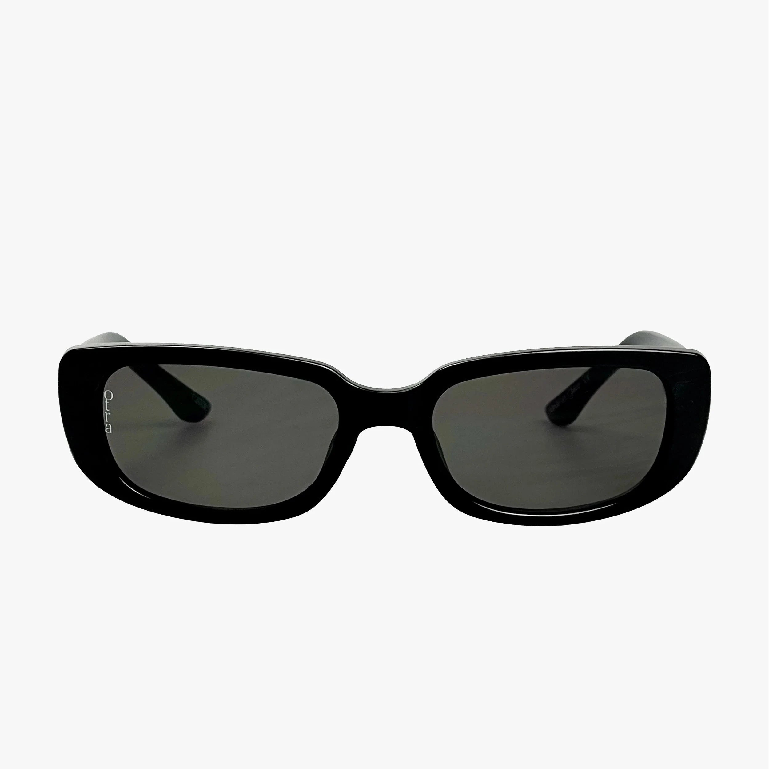 Black sunglasses with dark lenses on a white background