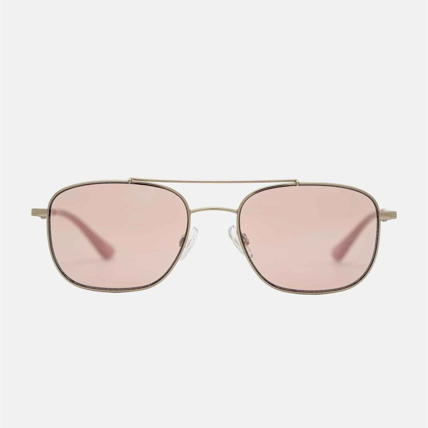 Sunglasses with pink lenses and gold frame on a white background