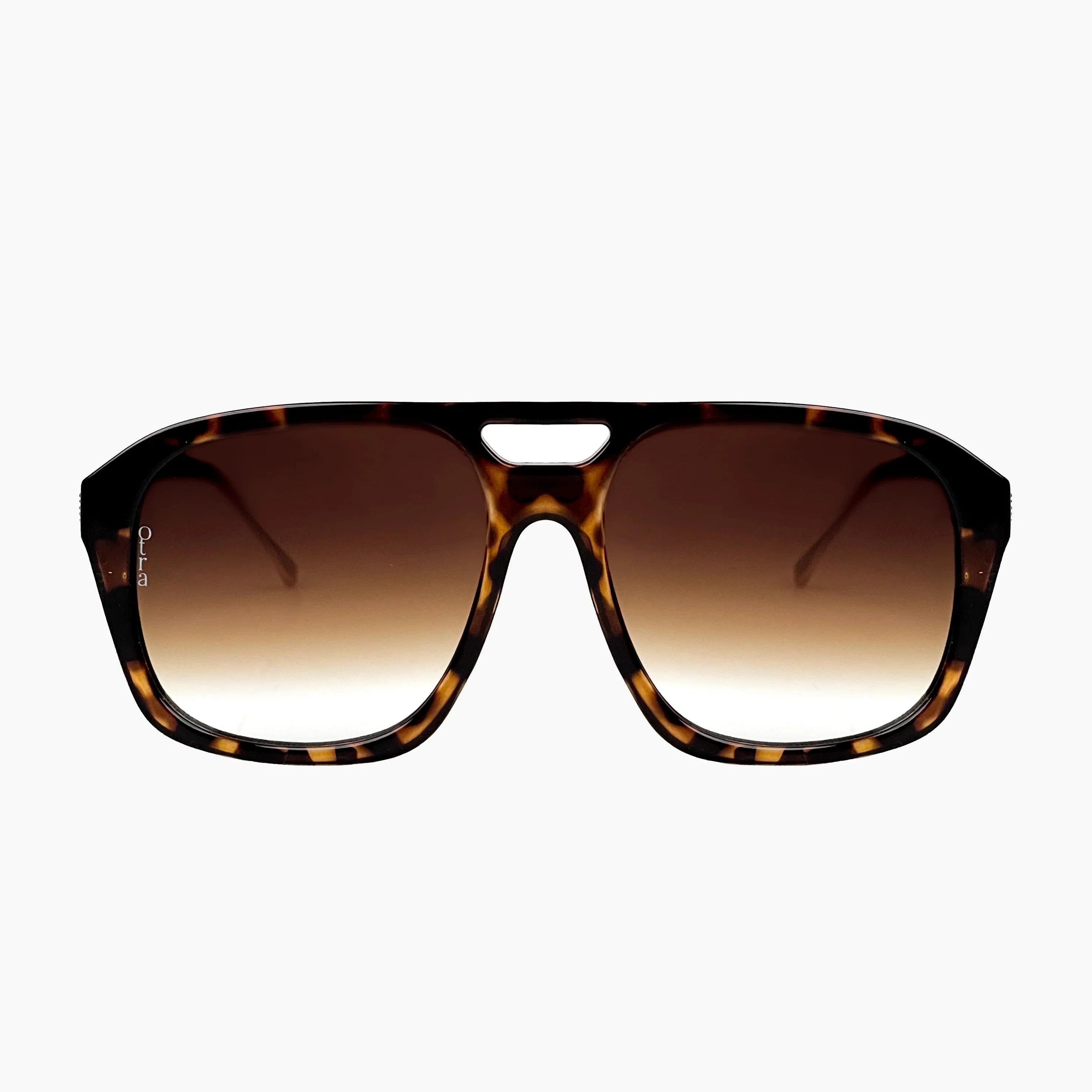 Sunglasses with tortoiseshell frame and gradient lenses on a white background