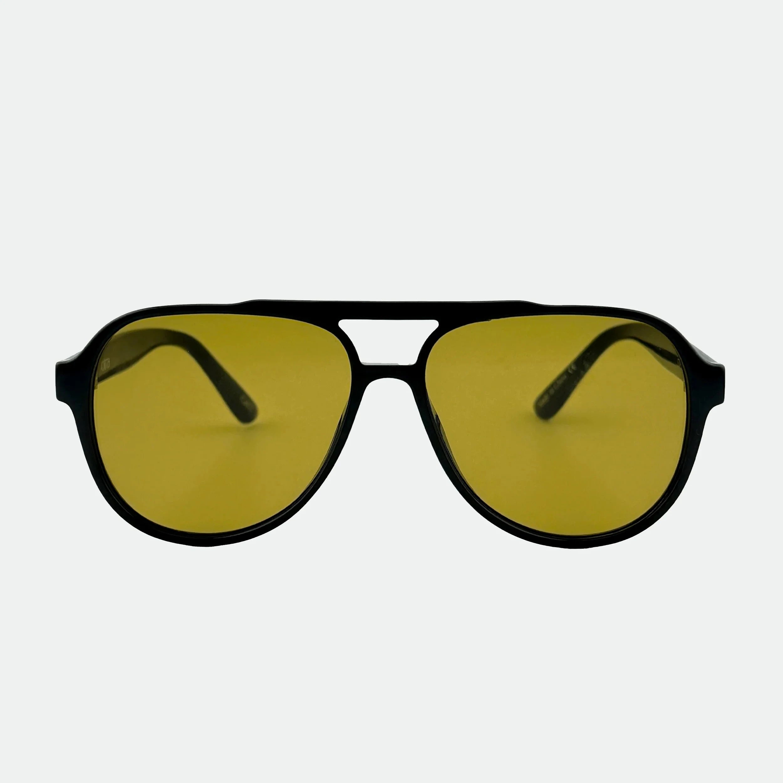 Aviator sunglasses with yellow lenses on a white background